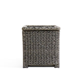 Front view of the Laguna Point end table with open lid, featuring the all-weather resin wicker frame and tempered glass top.